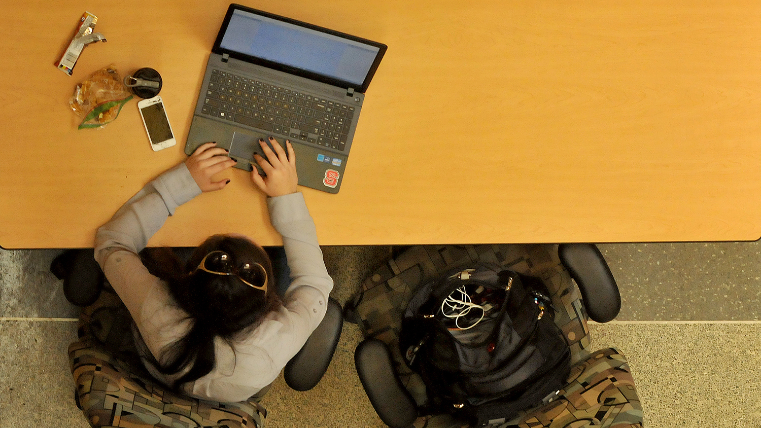 Student works on a laptop.