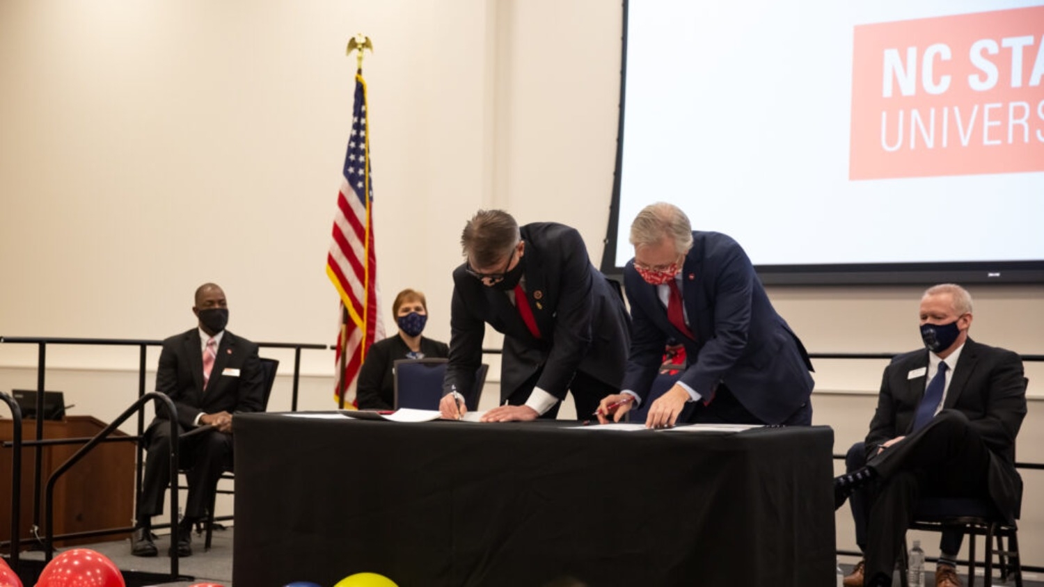 Dean David Hinks, President John Hauser, President Garrett Hinshaw